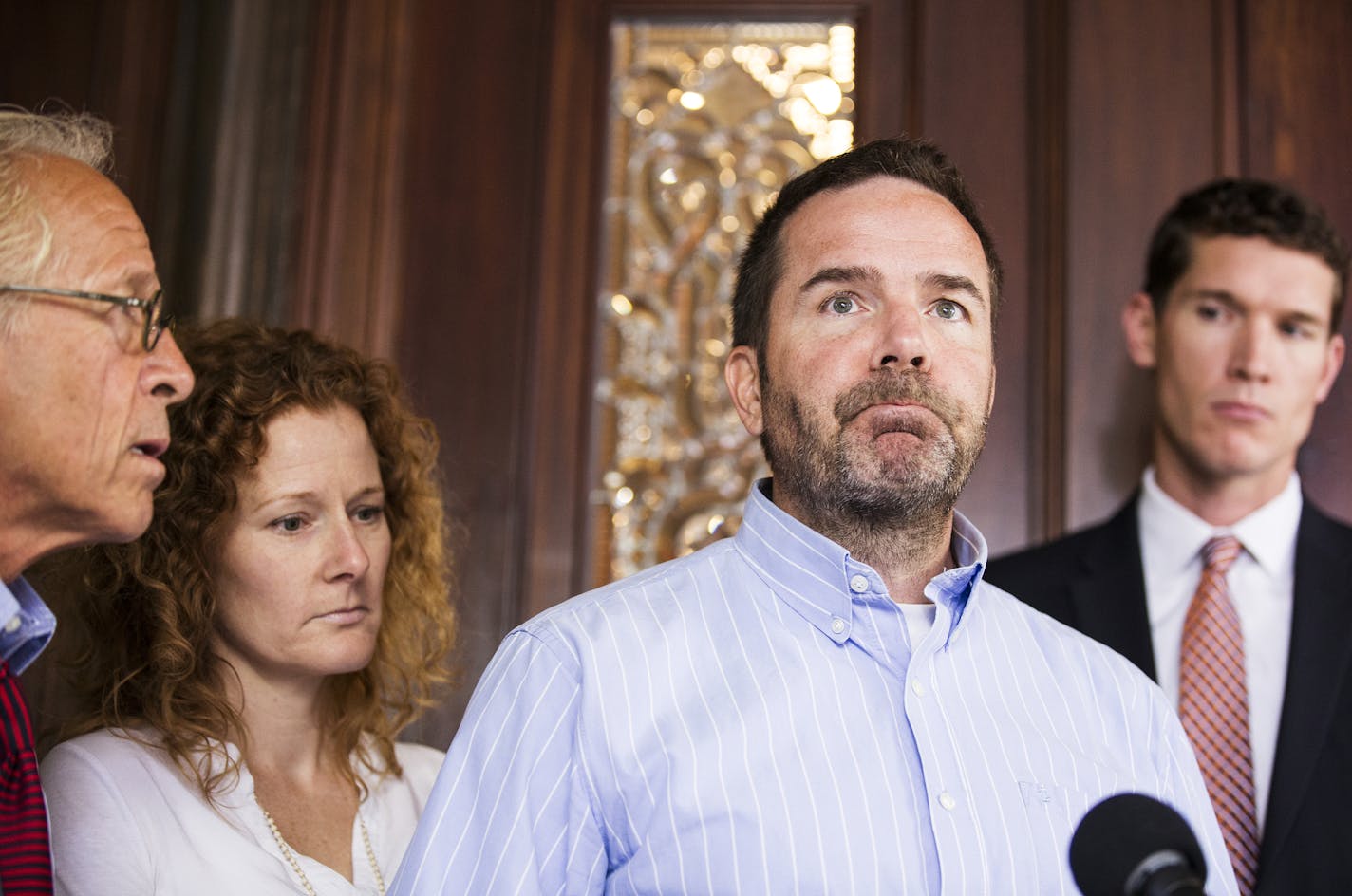 Joe McLean of Minneapolis, a survivor of alleged abuse by a priest of the Oblates of Mary Immaculate, speaks during a press conference at the office of Jeff Anderson & Associates in St. Paul on Tuesday, July 7, 2015. McLean is joined by his wife Colleen McLean and attorneys Jeff Anderson, left, and Mike Finnegan, right. ] LEILA NAVIDI leila.navidi@startribune.com / BACKGROUND INFORMATION: Joe McLean says he experienced the alleged abuse in 1981, at the age of 17, during confession at a retreat a