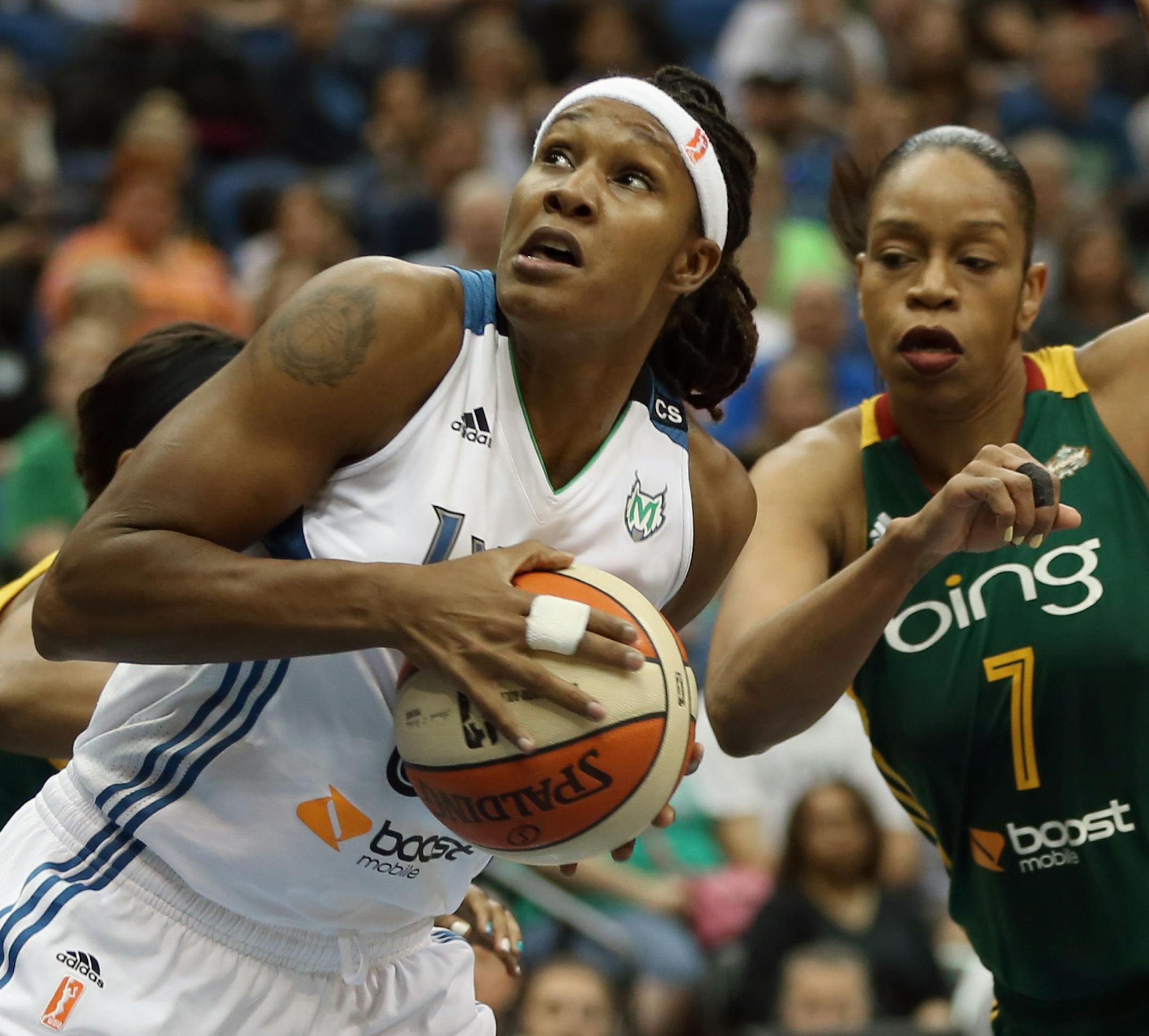 Minnesota Lynx vs Seattle Storm, WNBA Playoffs, 9/20/13. (left to right) Lynx's Rebekkah Brunson drove to the basket as she was defended by Storm's Tina Thompson in first half action.] Bruce Bisping/Star Tribune bbisping@startribune.com Rebekkah Brunson, Tina Thompson/roster.