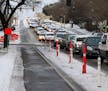 Vehicles were backed up along S. 28th Street in Minneapolis on a recent morning commute while the bike lanes stood empty. The recent addition of the b