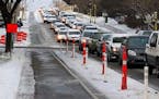 Vehicles were backed up along S. 28th Street in Minneapolis on a recent morning commute while the bike lanes stood empty. The recent addition of the b