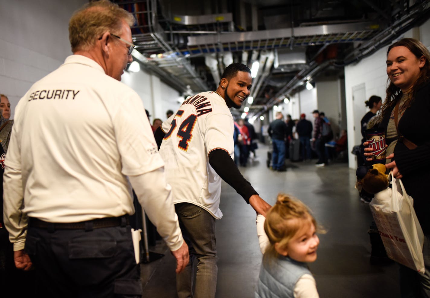 Twins starting pitcher Ervin Santana grabbed the hand of 3-year-old Hayden Gibson, daughter of pitcher Kyle Gibson, Friday at Twins Fest. ] AARON LAVINSKY &#xef; aaron.lavinsky@startribune.com Twins Fest kicked off Friday, Jan. 19, 2018 at Target Field in Minneapolis, Minn.