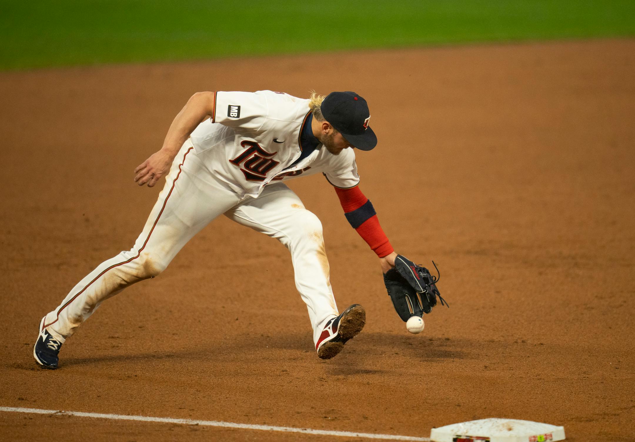 Minnesota Twins third baseman Josh Donaldson (20) earned an error in the sixth inning when he bobbled a ground ball hit by Chicago White Sox second baseman Nick Madrigal (1).