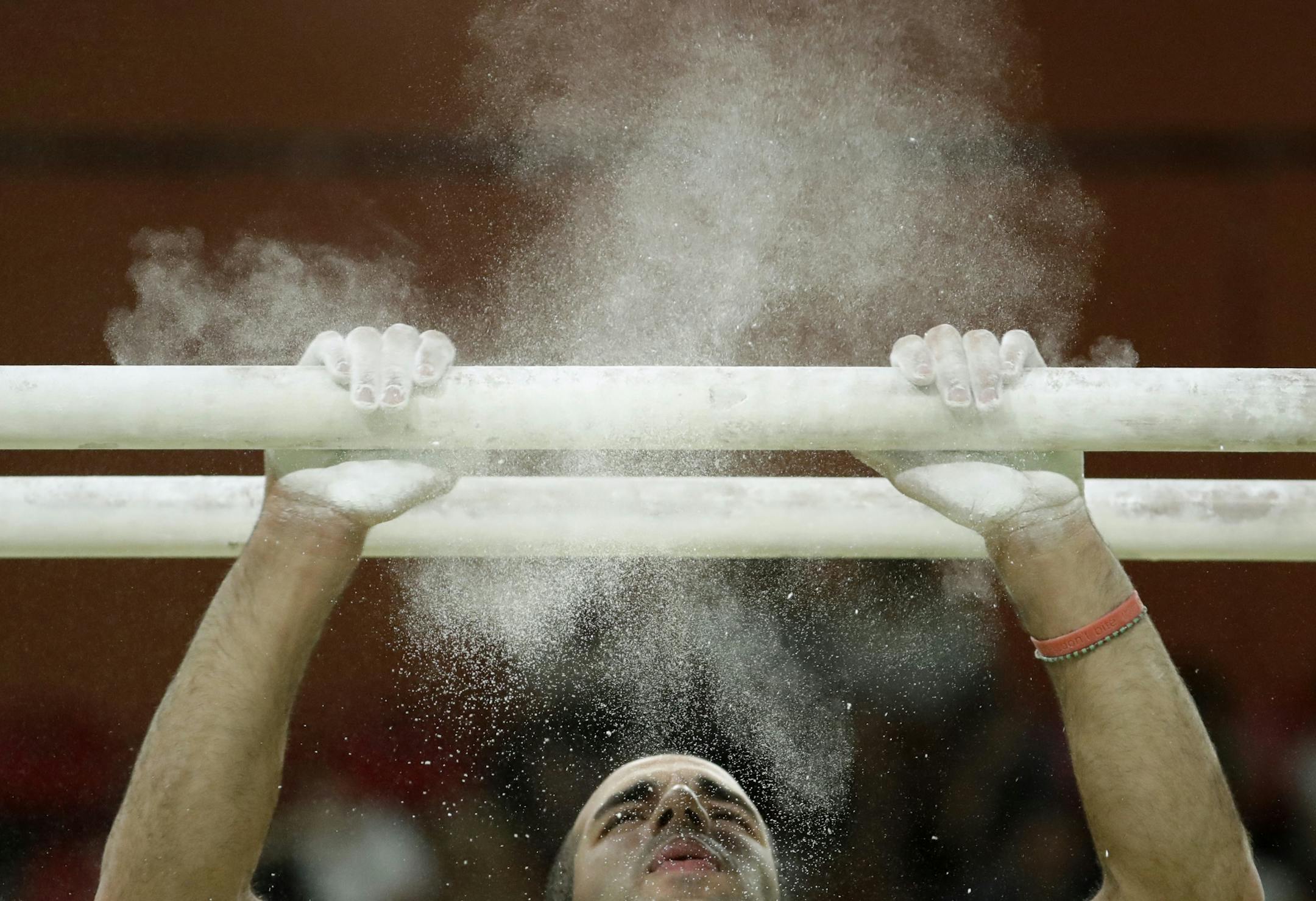 United States' Danell Leyva prepares for his performance on the parallel bars during the gymnastics exhibition gala at the 2016 Summer Olympics in Rio de Janeiro, Brazil, Wednesday, Aug. 17, 2016.