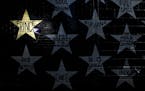 A gold star honoring Prince on the side of First Avenue in downtown Minneapolis.