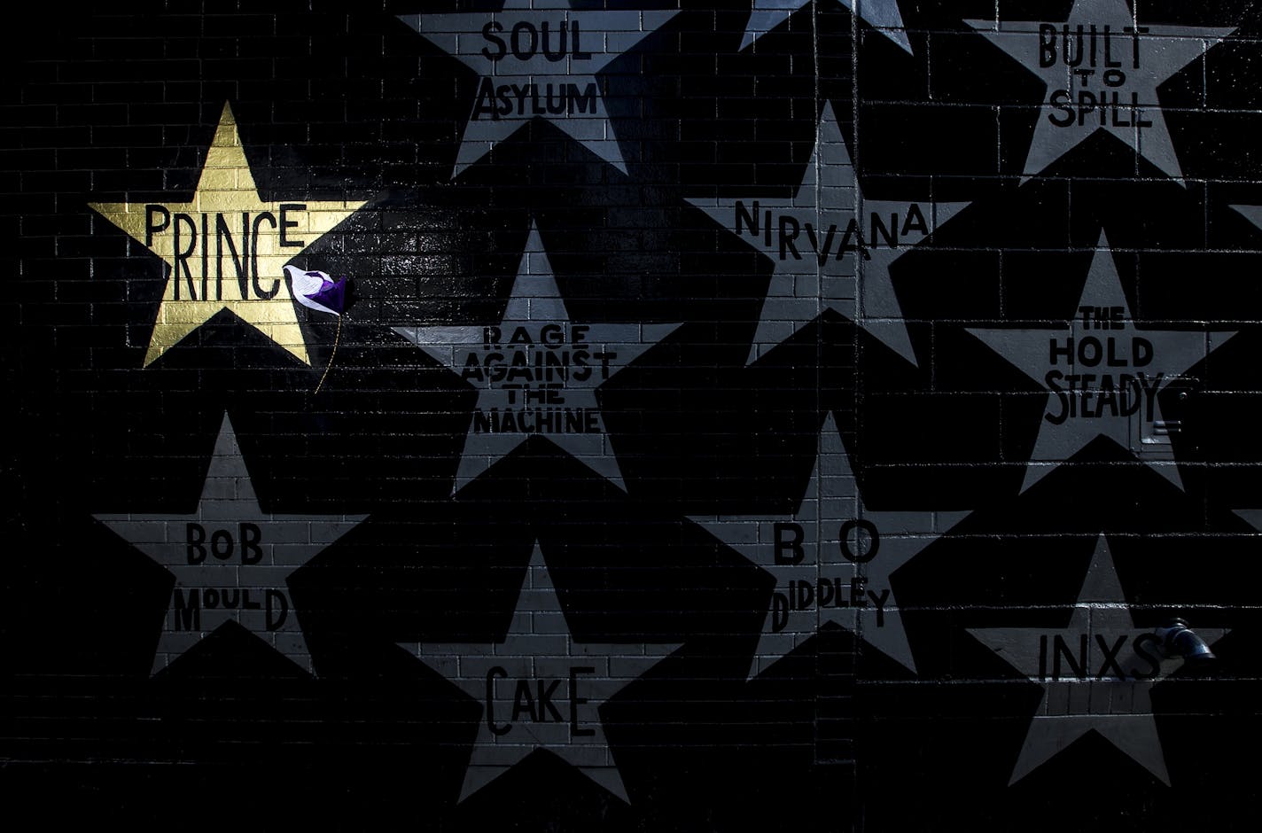 A gold star honoring Prince on the side of First Avenue in downtown Minneapolis.