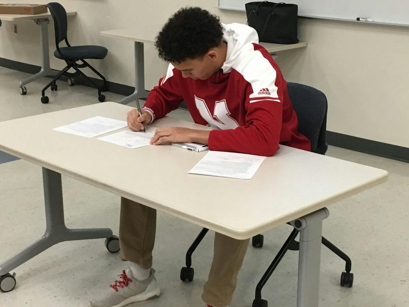 Woodbury senior David Alston signed a letter of intent Wednesday to play football at Nebraska.