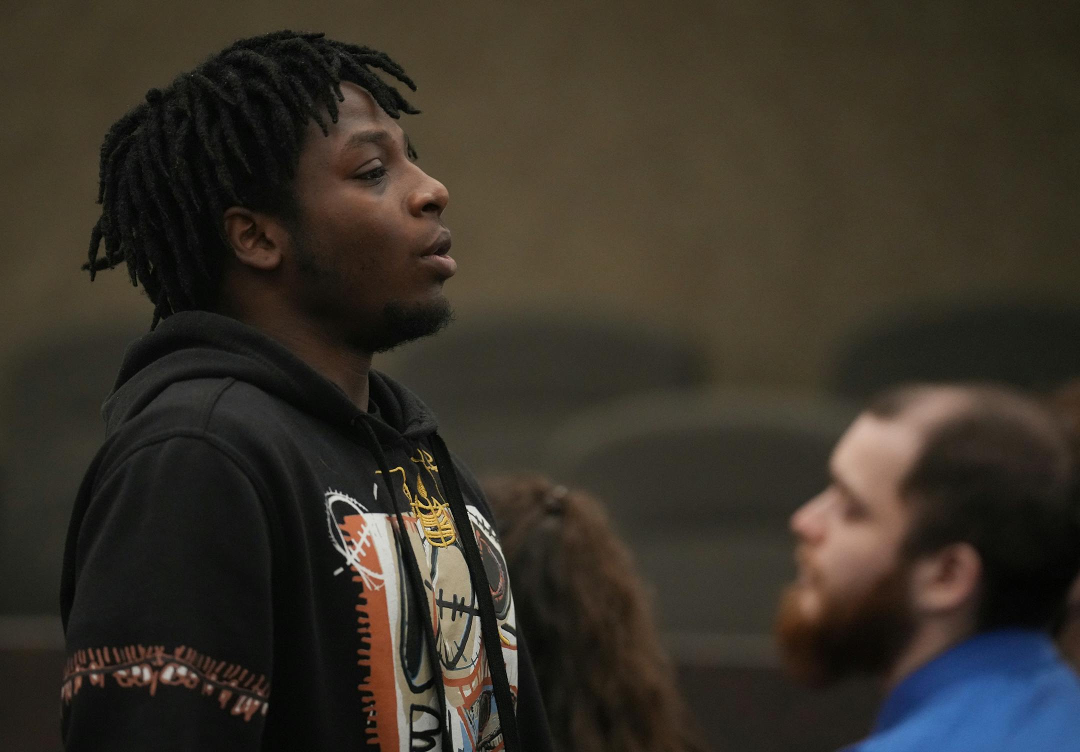 Zaheim Barbar, Deshaun Hill, Jr.'s cousin, exhales while returning to his seat after giving a victim impact statement.