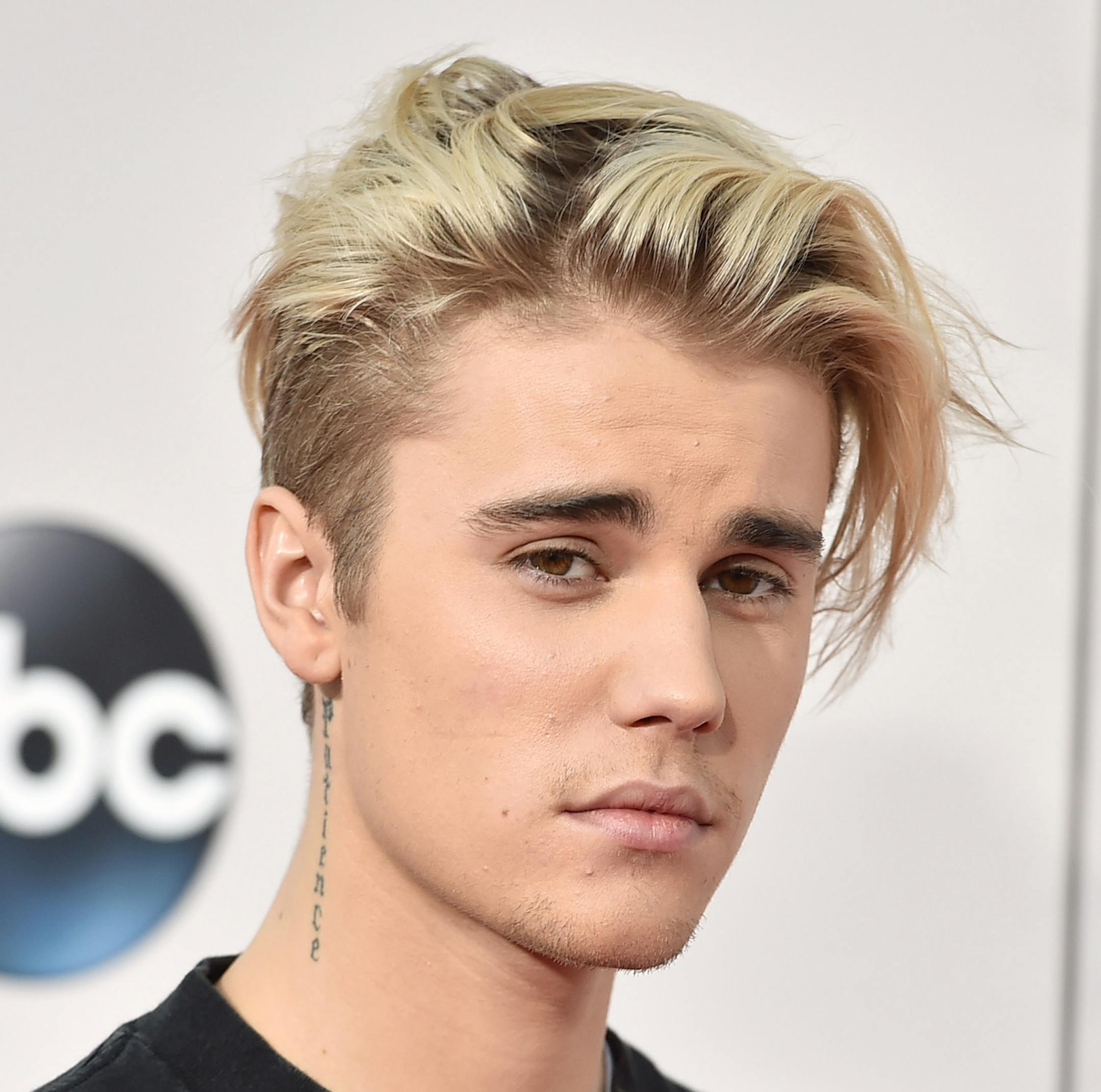 FILE - In this Sunday, Nov. 22, 2015 file photo, Justin Bieber arrives at the American Music Awards at the Microsoft Theater in Los Angeles. With his recent batch of hit singles and semi-grown-up sound - including the electro-pop "Where Are U Now" with DJ-producers Skrillex and Diplo - adult men have begun attending the church of Bieber, and while some have issues admitting it, other proudly say they are Beliebers. ìSorryî and ìWhat Do You Mean,î currently at Nos. 2 and 4 on