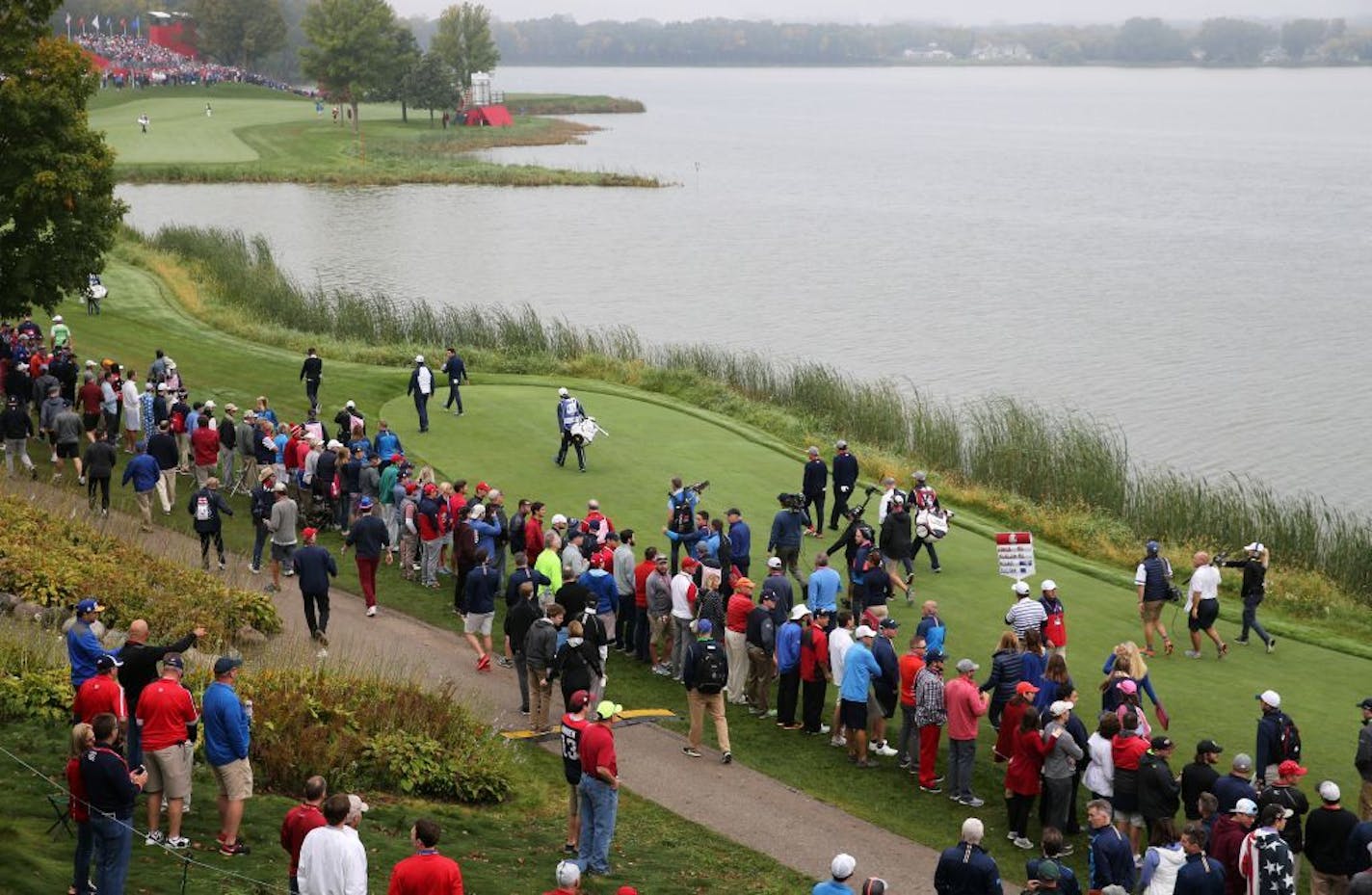 Hole 7, where an unauthorized floatplane dropped anchor Sunday, straddles Hazeltine Lake and is a popular hole for fans.