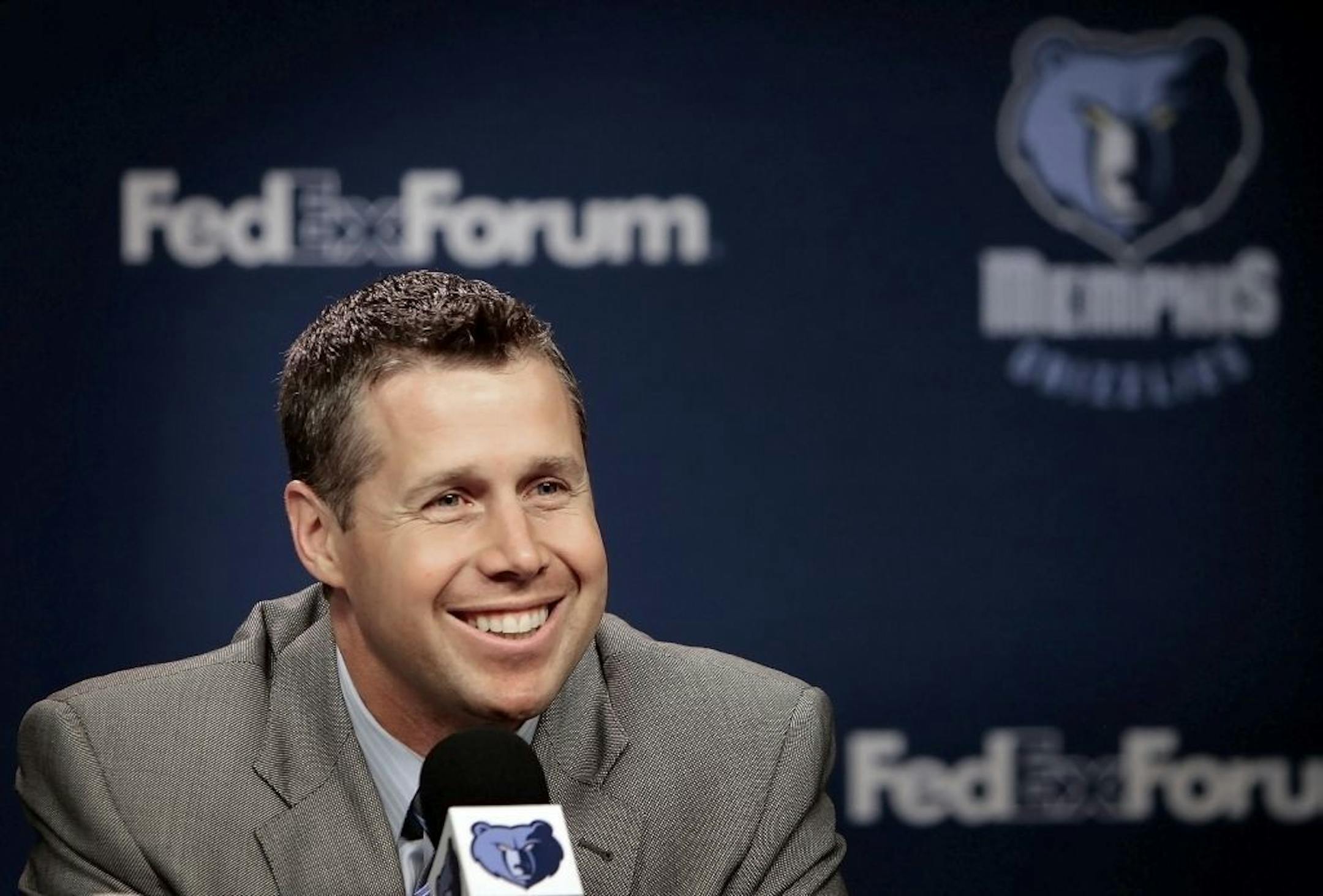 Memphis Grizzlies' new head coach David Joerger smiles during an introductory NBA basketball news conference Thursday, June 27, 2013, in Memphis, Tenn. Joerger, 39, was a successful head coach in the minor leagues and was the lead assistant under former Grizzlies coach Lionel Hollins the last two seasons. He has been with the team six seasons.