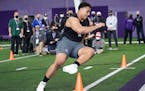 Northwestern offensive lineman Rashawn Slater participates in the school's Pro Day football workout for NFL scouts on March 9.
