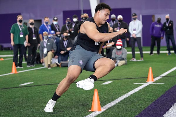 Northwestern offensive lineman Rashawn Slater participates in the school's Pro Day football workout for NFL scouts on March 9.