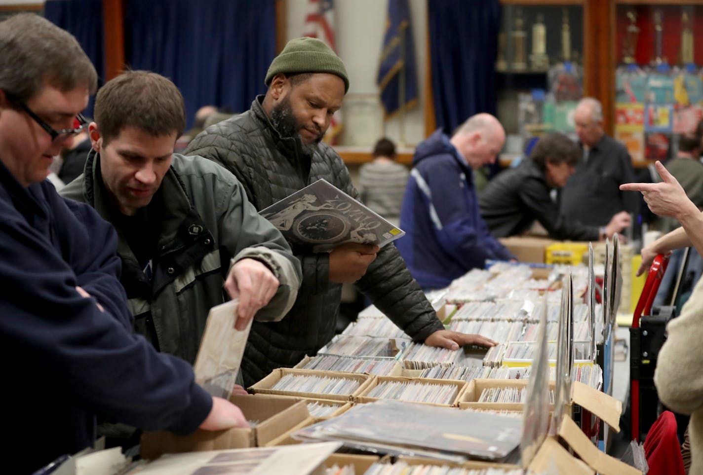 Chaka Mkali of Minneapolis, center, who has been coming to the Record Show for 20 years, looks through the thousands of records for vinyl pressings of krautrock, a genre of experimental rock that developed in Germany in the 1960s. &#x201c;I&#x2019;m real focused,&#x201d; Mkali said. &#x201c;There&#x2019;s a science to it.&#x201d;