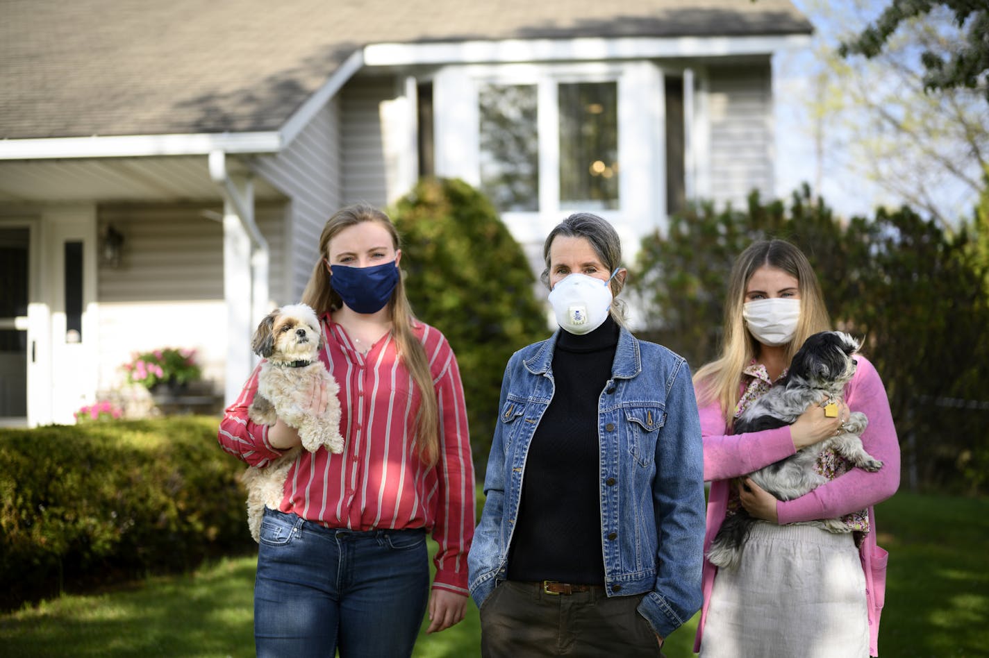 Sharon Carlson stood beside her daughters, Jaime, left, and Kristin, 26, outside their Andover home.