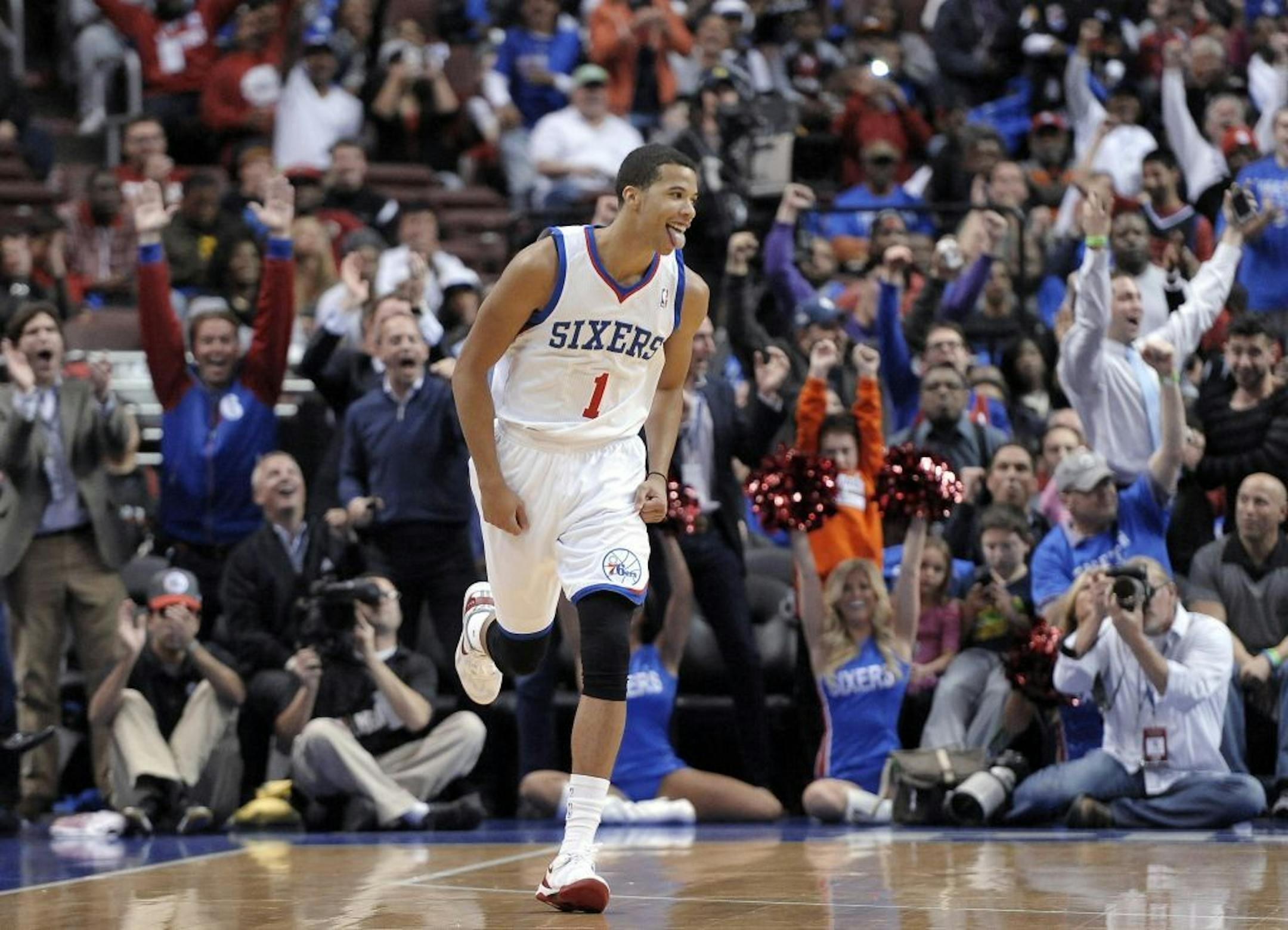Philadelphia 76ers' Michael Carter-Williams (1) celebrates after making a 3-point basket during the first half of an NBA basketball game against the Miami Heat, Wednesday, Oct. 30, 2013, in Philadelphia. The 76ers won 114-110.