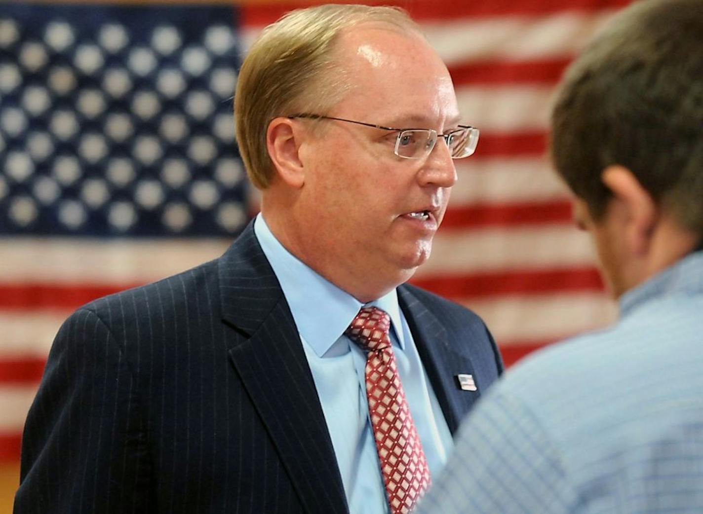 FILE - In this Wednesday, Sept. 4, 2013, file photo, Jim Hagedorn speaks with reporters after announcing his candidacy for Minnesota's 1st Congressional District seat held by Rep. Tim Walz, near Good Thunder, Minn. Republican congressional hopeful Hagedorn is standing by his years-old blog posts where he lambasted women, American Indians, gays and national political figures. Hagedorn defended his opinions as humorous and satirical, saying he criticized politicians of all stripes, not just Democr