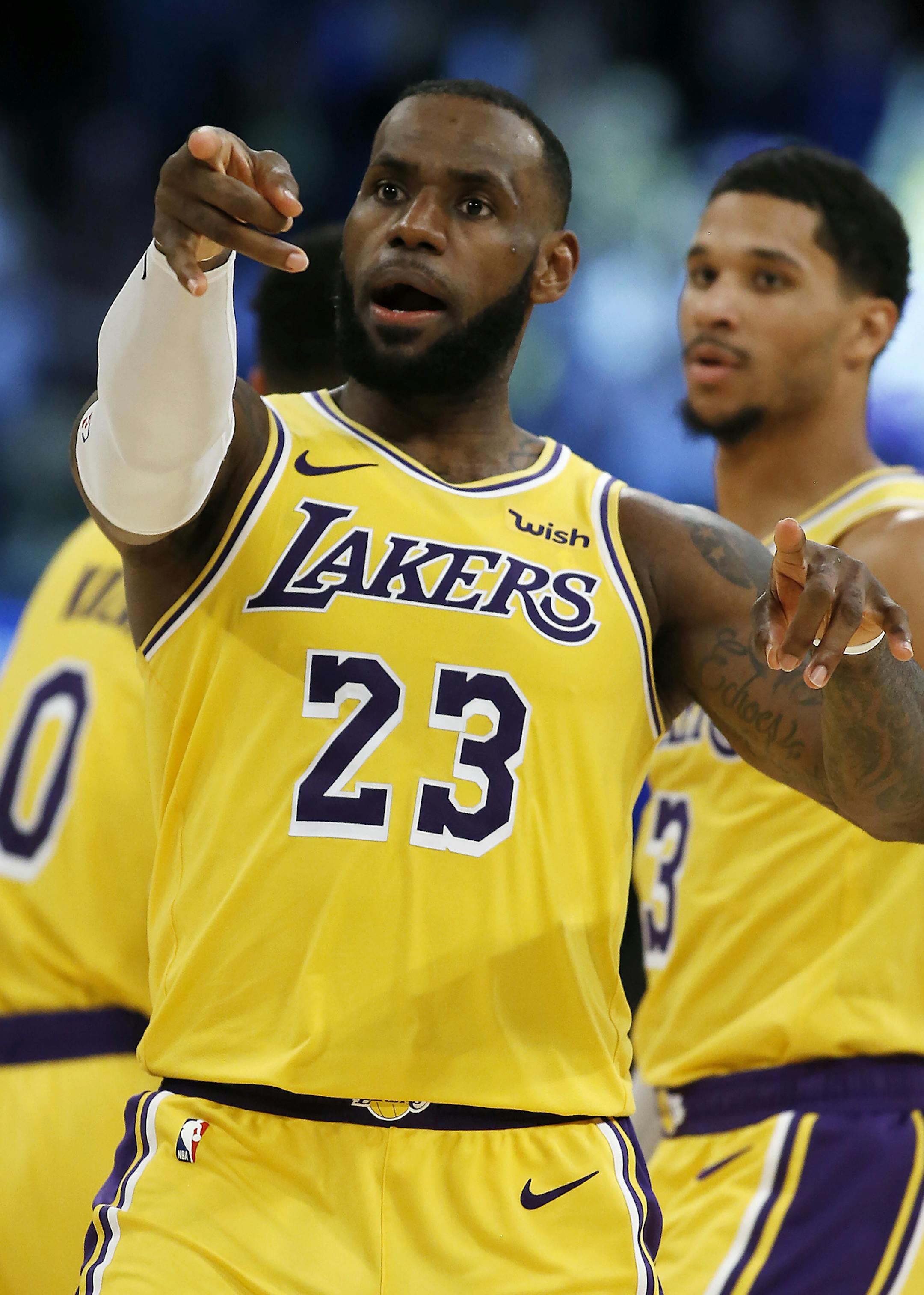Los Angeles Lakers forward LeBron James congratulates a pass by guard Lance Stephenson for a James' dunk during the second half of an NBA basketball game against the Denver Nuggets in Los Angeles, Thursday, Oct. 25, 2018. Lakers won 121-114. (AP Photo/Alex Gallardo)