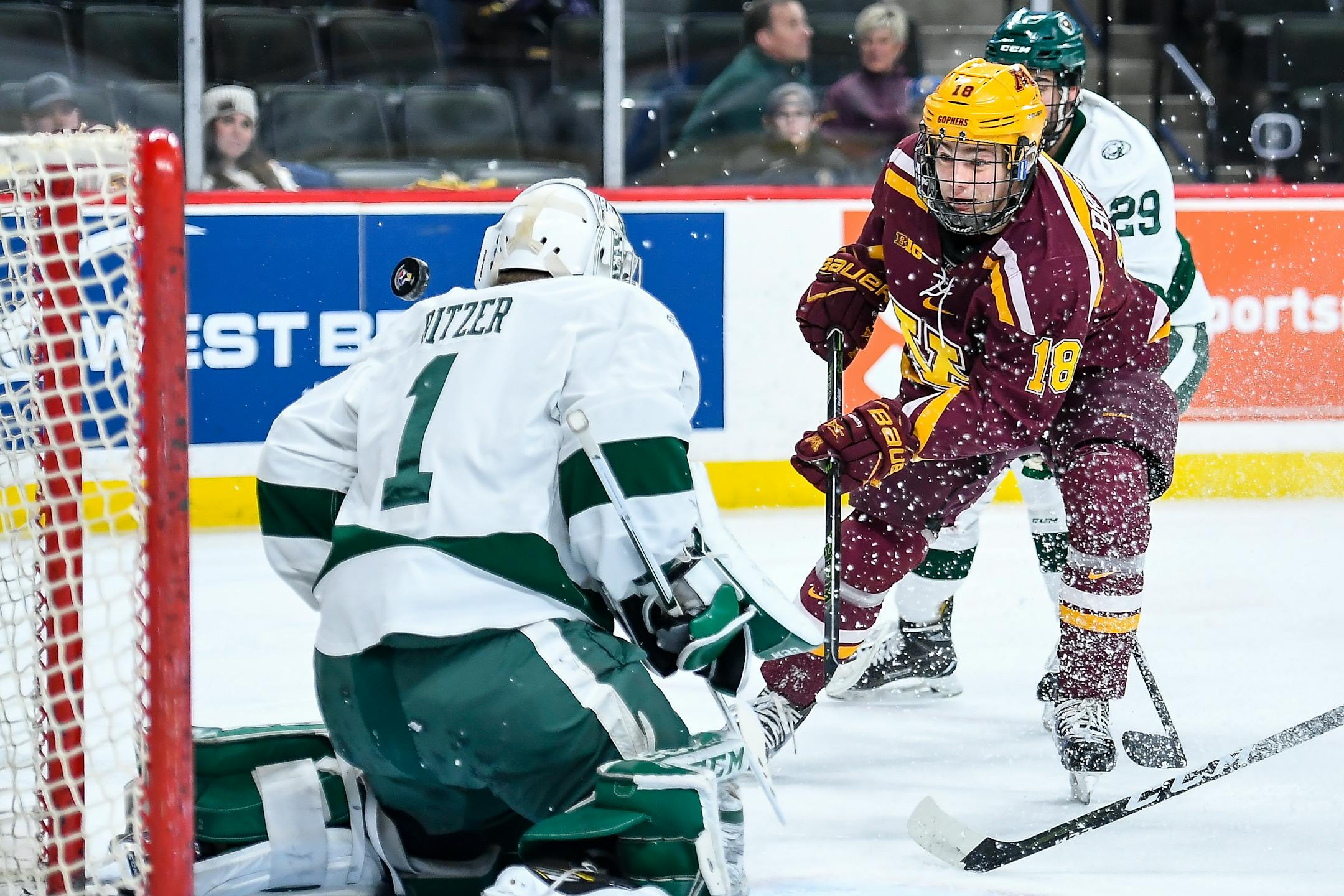 Minnesota Golden Gophers left wing Leon Bristedt (18) was unable to capitalize on a scoring attempt against Bemidji State Beavers goalie Michael Bitzer (1) in the first period Saturday.