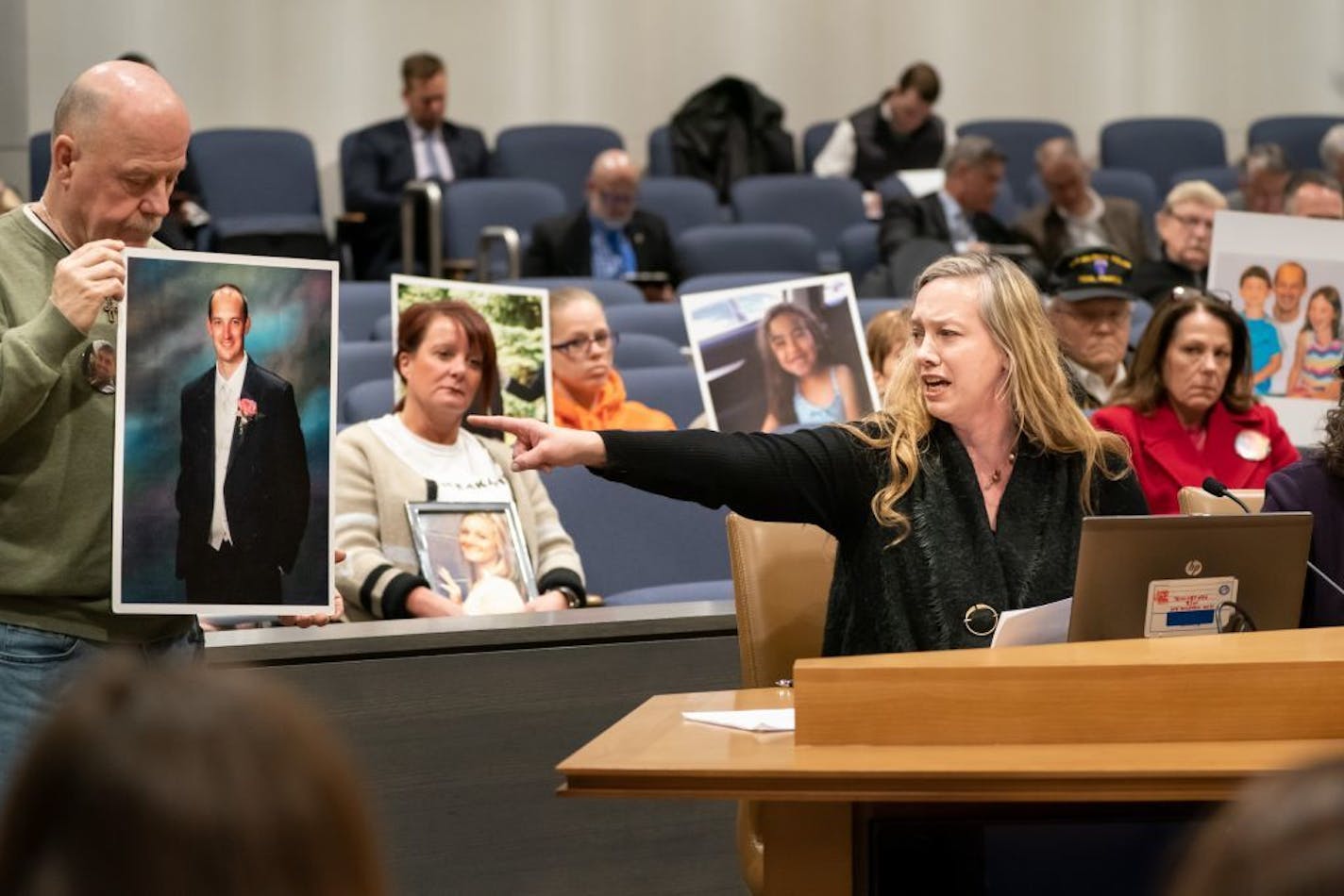 Danielle Wishard-Tudor pointed toward a photograph of her brother Jean Claude Wishard, who was killed by a distracted driver.