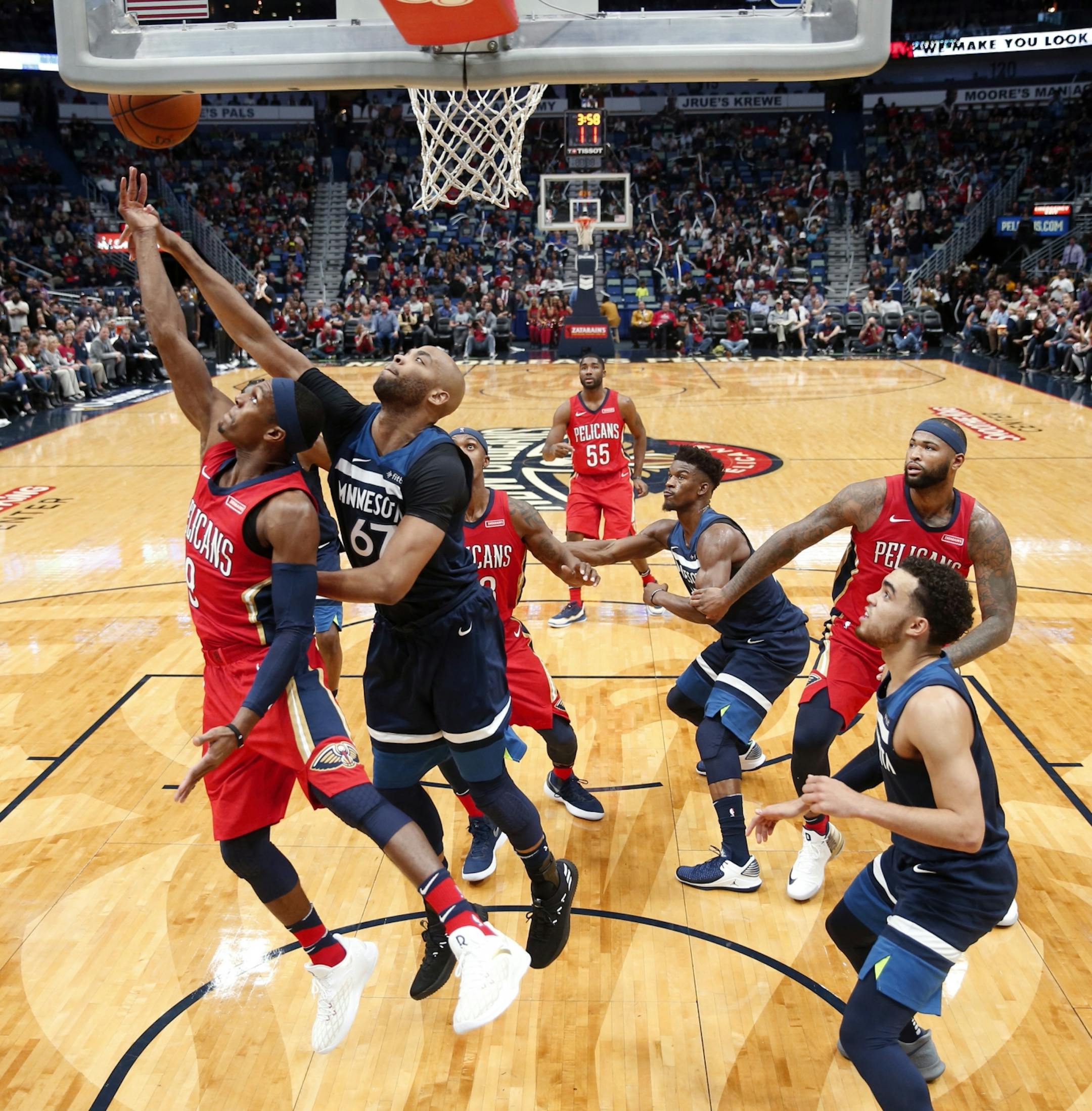 New Orleans Pelicans guard Rajon Rondo, left, looks for a shot as Minnesota Timberwolves forward Taj Gibson (67) defends during the first half of an NBA basketball game in New Orleans, Wednesday, Nov. 29, 2017.