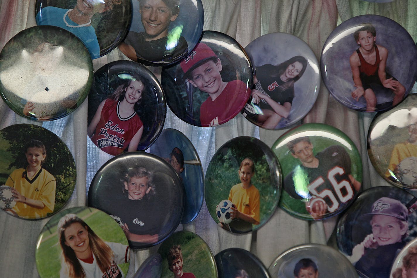 Photo buttons of Mandy Matula and her brother, Steven, are on display at the family home in Eden Prairie.