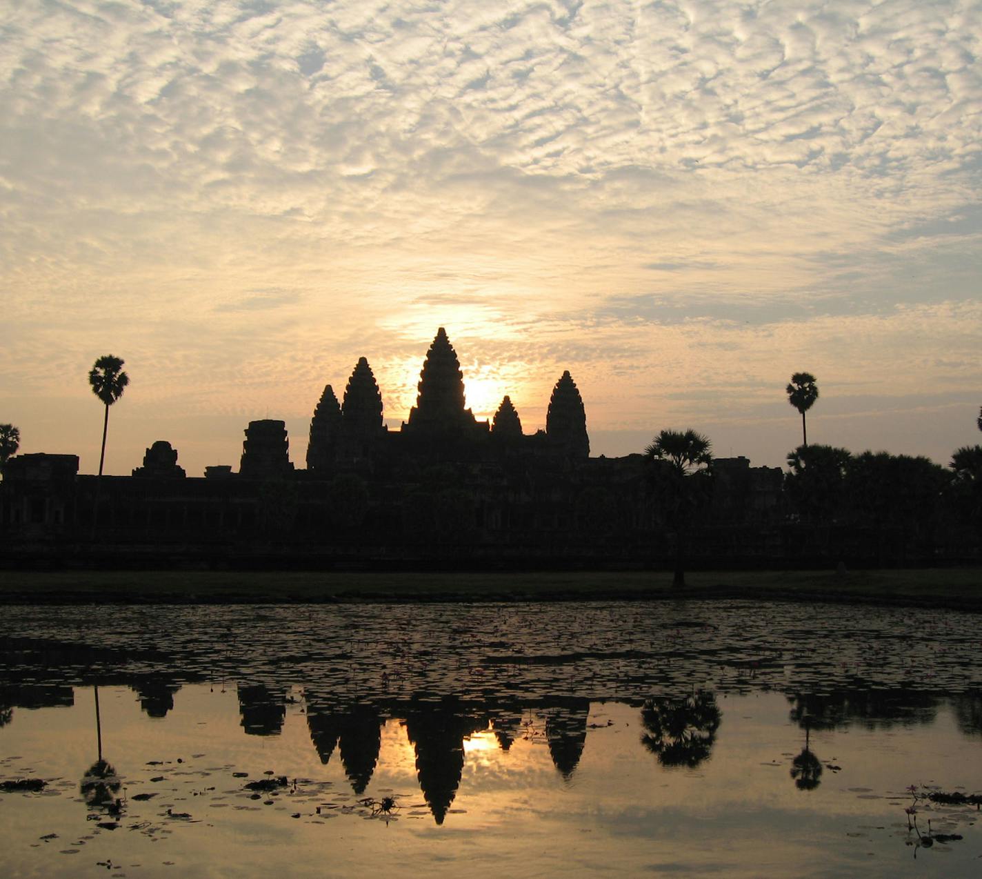 The conical shaped towers of Angkor Wat compete with the sun for a high point in the sky. Visitors to Angkor Wat in Siem Reap, Cambodia, will rarely find themselves free of the crowds of tourists, but at sunrise there is at least a hush as observers watch the dawn. (Anne Chalfant/Contra Costa Times/MCT)