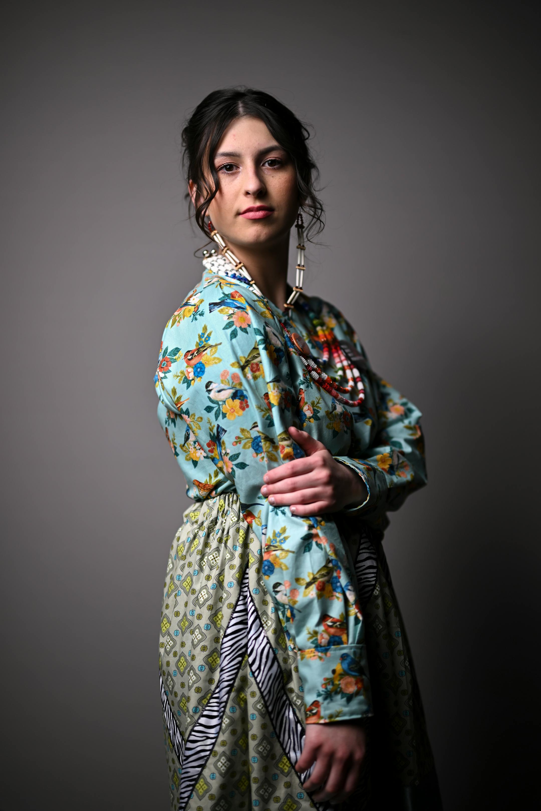 Hannah Gullickson, with the Boise Forte Band of Ojibwe, stands for a portrait during "Northern Lights: A Native Nations Fashion Night." Gullickson is wearing designs by artist Lavender Hunt.