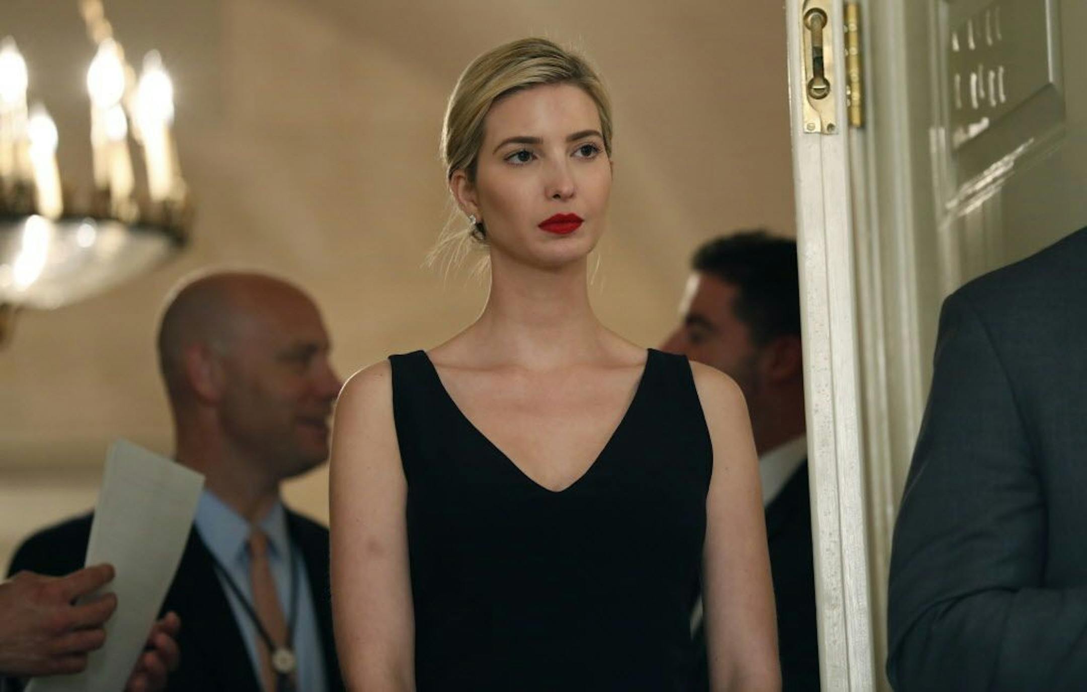 Ivanka Trump, the daughter and assistant to President Donald Trump, stands in the doorway as President Donald Trump speaks before signing bills in the Diplomatic Reception Room at the White House, Friday, June 2, 2017, in Washington. Trump signed two bills, the American Law enforcement Heroes Act of 2017 and Public Safety Officers Benefits improvement Act of 2017.