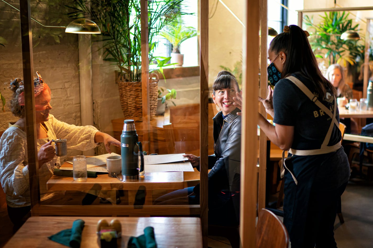 Anna Botz and Jessica Mealey were some of the first customers through the door as Hope Breakfast Bar opened its indoor dining room. Owners Brian and Sarah Ingram spent $30,000 to install plexiglass partitions between booths and other measures to protect guests and staff. ] GLEN STUBBE • glen.stubbe@startribune.com Wednesday, June 10, 2020 Indoor dining reopens for the first time since March 17. Hope Breakfast Bar has spent $30,000 to install plexiglass partitions between booths and other measure