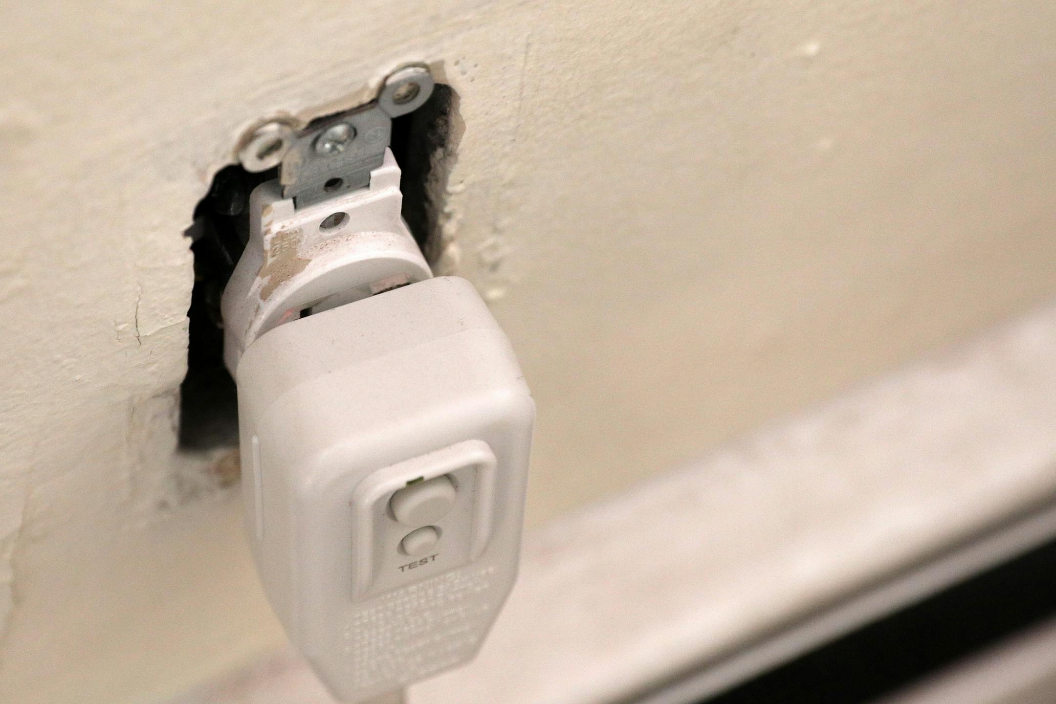 Exposed outlets could be seen in Angelleece Hawkins' apartment unit.