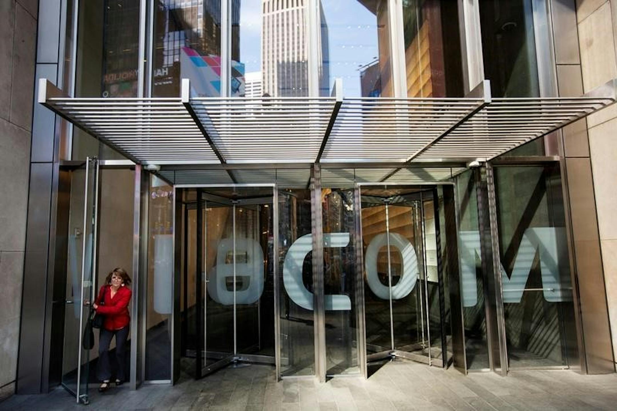 A woman exits the Viacom Inc. headquarters in New York April 30, 2013. REUTERS/Lucas Jackson/File Photo