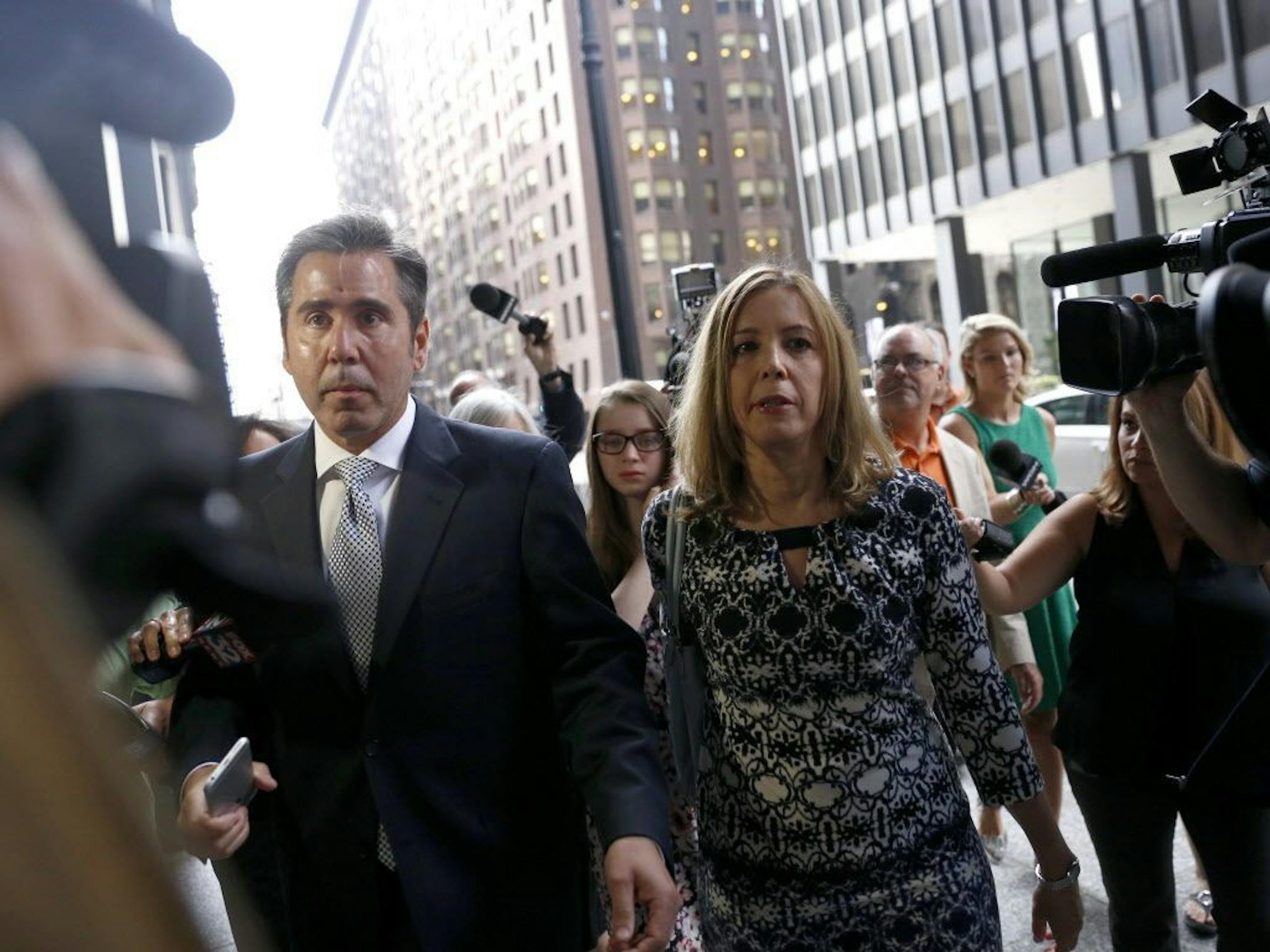 Patti Blagojevich, right, wife of former Illinois Gov. Rod Blagojevich arrives at the federal courthouse Tuesday, Aug. 9, 2016 in Chicago. A federal judge will decide whether to cut ex-Illinois Gov. Rod Blagojevich's 14-year prison sentence after an appeals court threw out some of his convictions related to his alleged attempt to sell or trade an appointment to President Barack Obama's old Senate seat.
