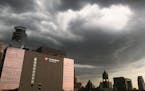 Dark clouds rolled into the Twin Cities early Thursday evening, bringing rain, thunder and lightning to much of the area, including downtown Minneapol
