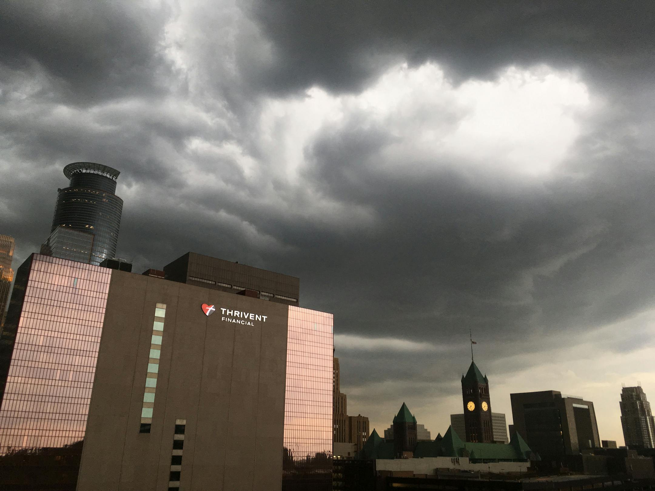 Dark clouds rolled into the Twin Cities early Thursday evening, bringing rain, thunder and lightning to much of the area, including downtown Minneapolis.