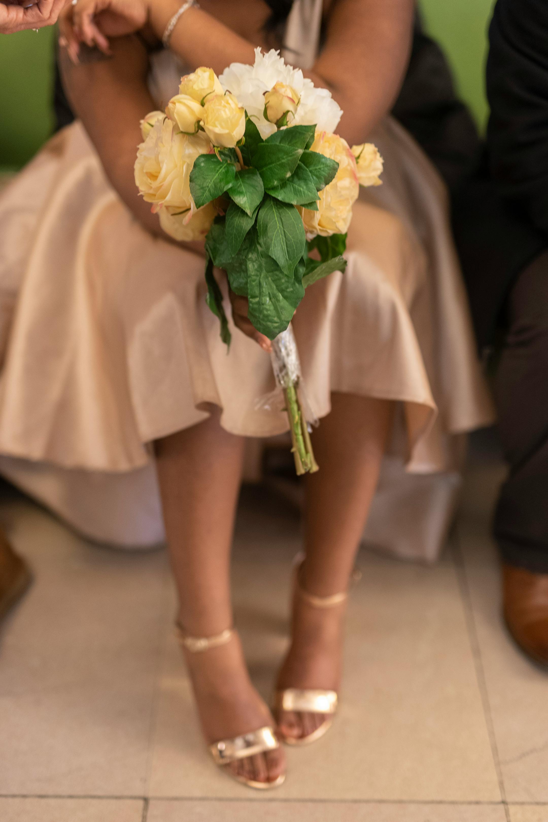 FILE — Jazmine Parham holds a rental bouquet before marrying Sean Kovach at City Hall, in New York, Dec. 14, 2018. "We are nearing a time when there will be more unmarried adults in the United States than married ones," writes The New York Times opinion columnist Charles M. Blow. (David La Spina/The New York Times)