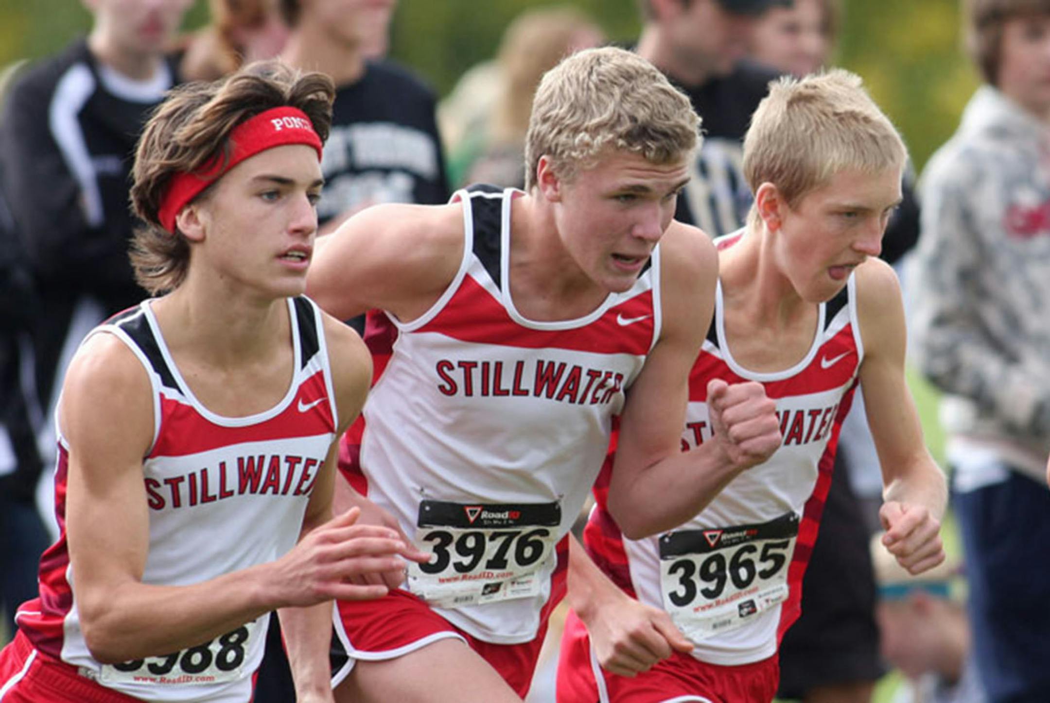 Stillwater runners Wayde Hall, left, and Eric Colvin, center, are both headed to the Gophers, but for now the focus is on winning once more in high school.