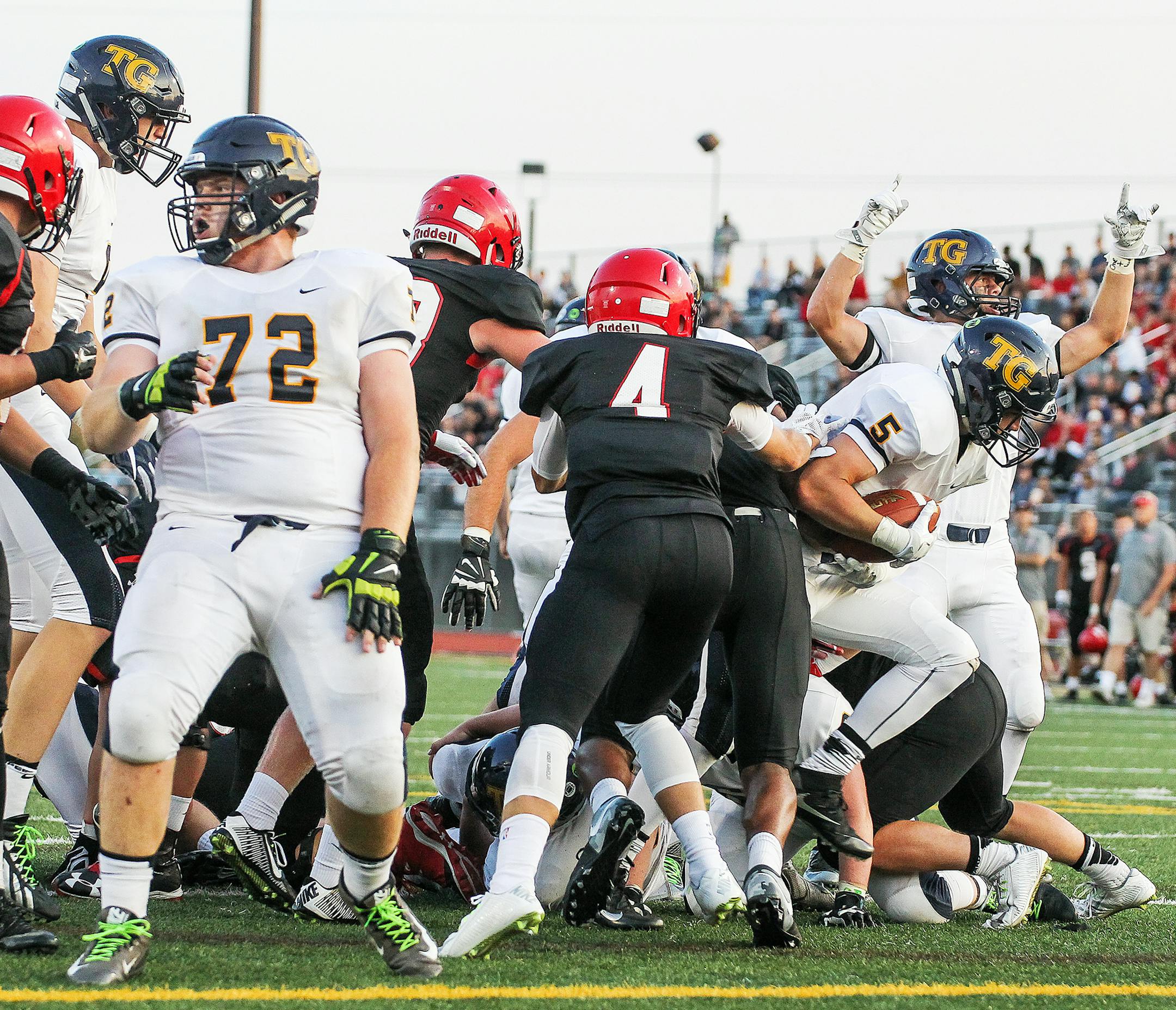 Running back Ivan Burlak (5) scored in the second quarter to help Totino-Grace rally past Eden Prairie on Thursday.