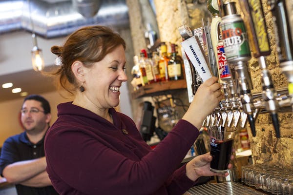Catherine Pflueger, general manager of Stone Tap in Hudson, Wis., poured an American Velvet, a coffee stout brewed in Hudson by American Sky Beer.