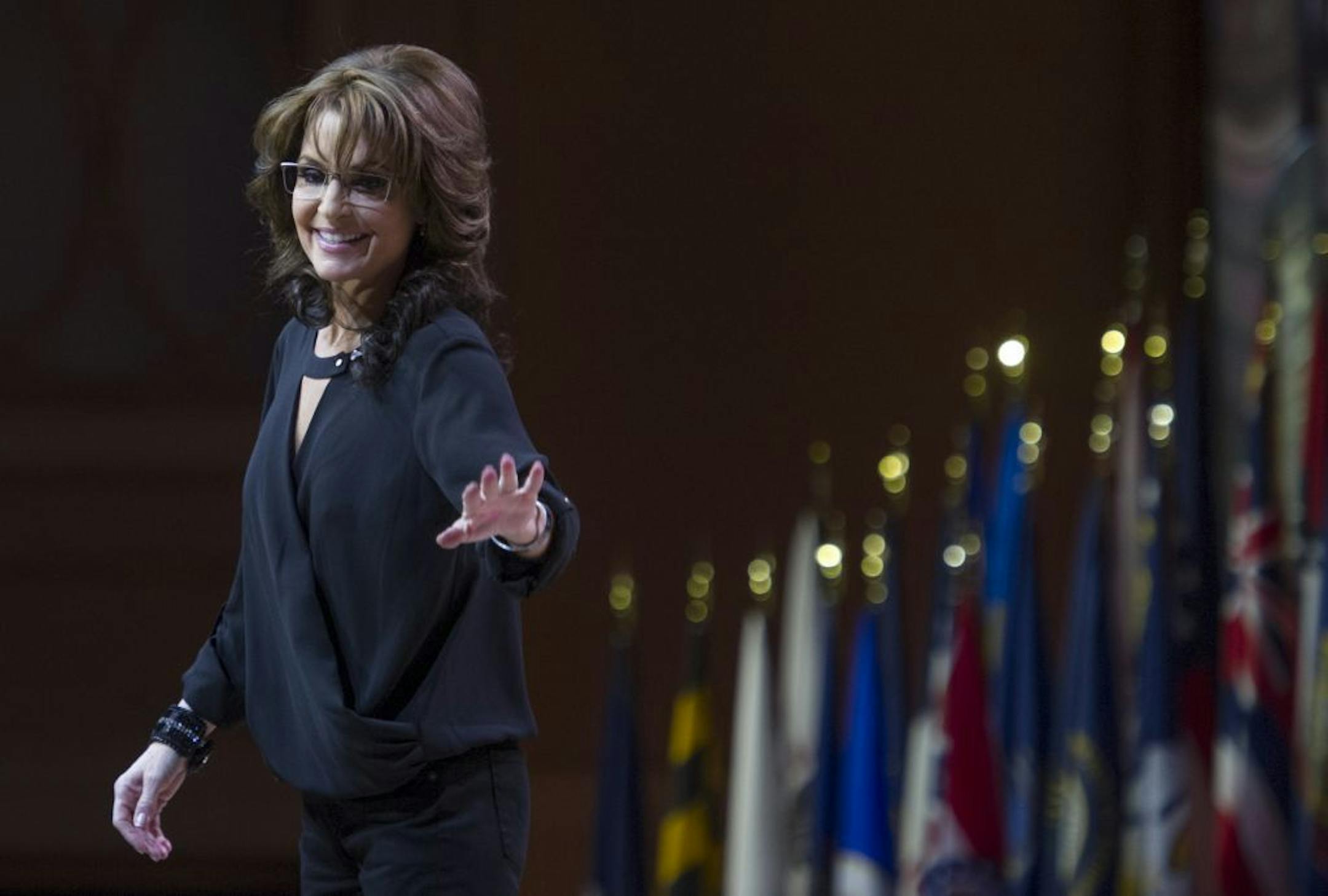 Former Alaska Gov. and 2008 Republican vice presidential nominee Sarah Palin waves as she walks off-stage after addressing the Conservative Political Action Committee annual conference in National Harbor, Md., Saturday, March 8 ,2014. Saturday marks the third and final day of the annual Conservative Political Action Conference, which brings together prospective presidential candidates, conservative opinion leaders and tea party activists from coast to coast.