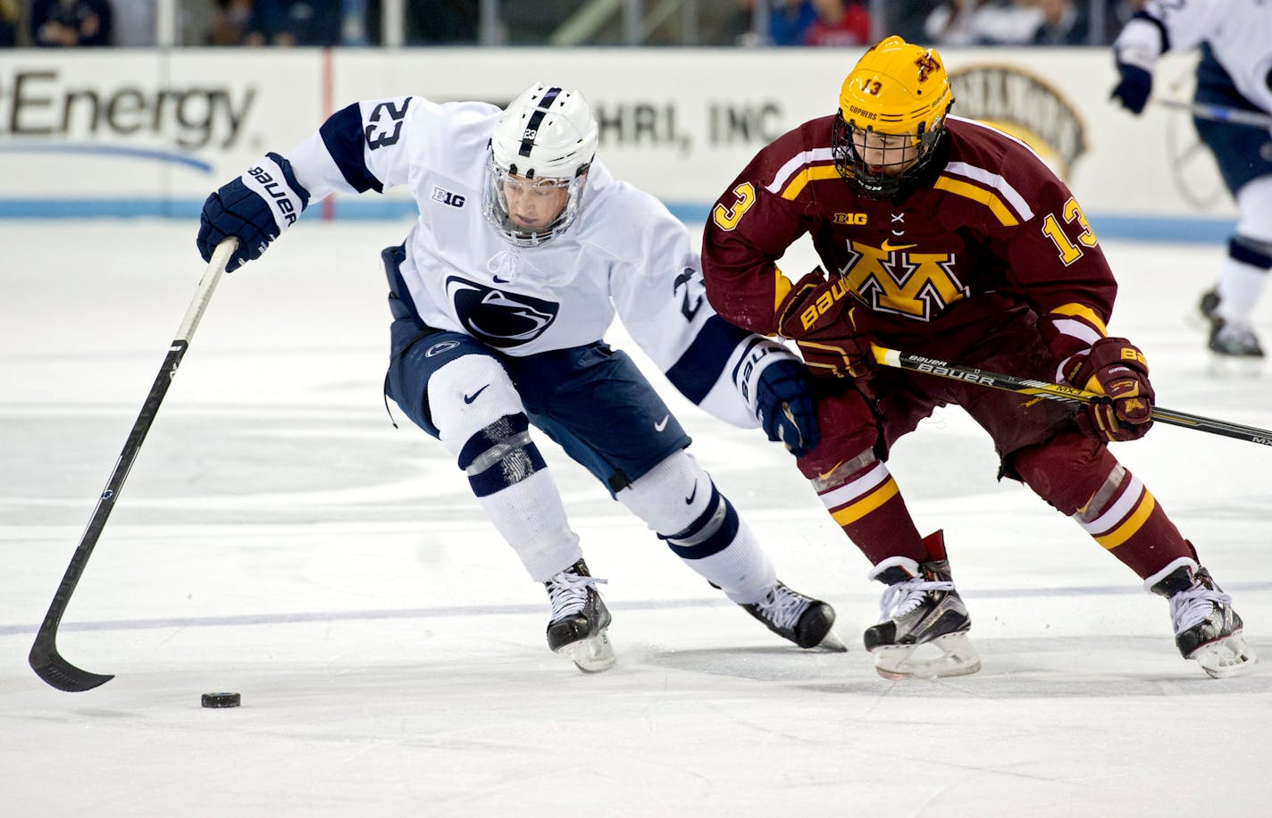 Penn State's Eric Scheid and Minnesota's Tay Cammarata fight for the puck during the Saturday, January 9, 2016 game against Minnesota at Pegula Ice Arena. Minnesota won 7-1. ORG XMIT: B735948397Z.1