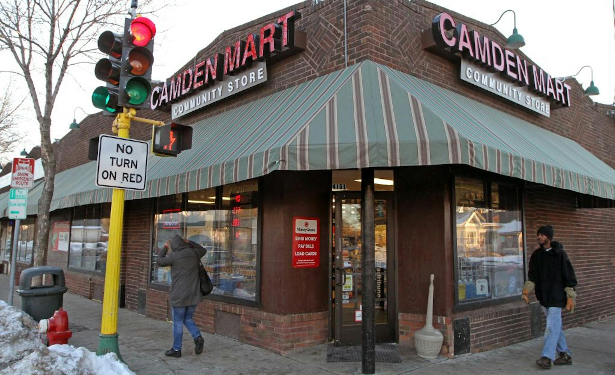 Customers walked both from and to the Camden Mart in North Minneapolis on 12/22/12. Kevin Aldwaik is manager of Camden Mart, but he does more than sell supplies. He's chased down a bike thief, offered free soda and ice on National Night Out and posted on his FB site that he'd shovel the snow for any elderly neighbors who needed it.