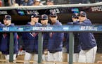 The Twins dugout watched action on the field during an AL Division Series loss to the Yankees.