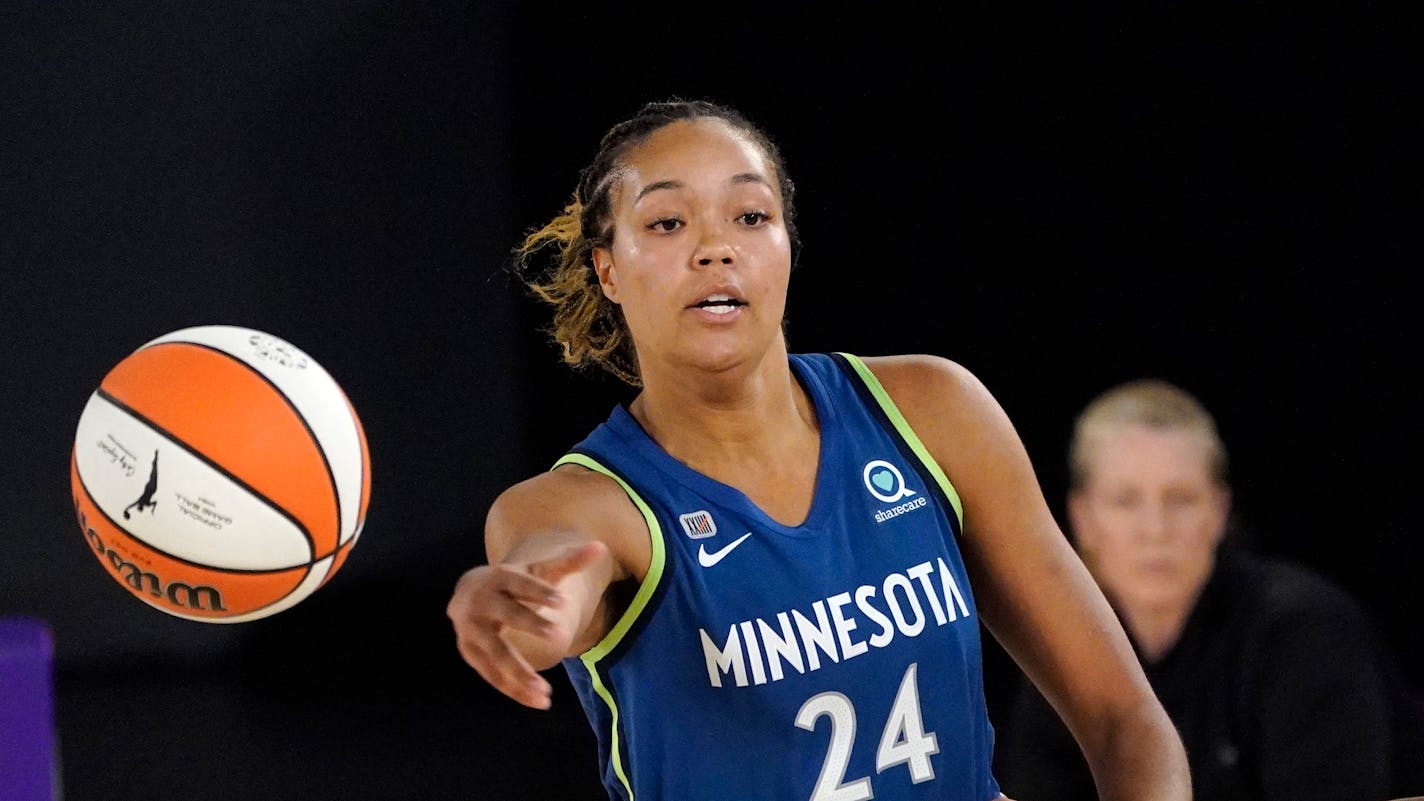 Minnesota Lynx forward Napheesa Collier passes during the first half of a WNBA basketball game against the Los Angeles Sparks Sunday, July 11, 2021, in Los Angeles. (AP Photo/Mark J. Terrill)