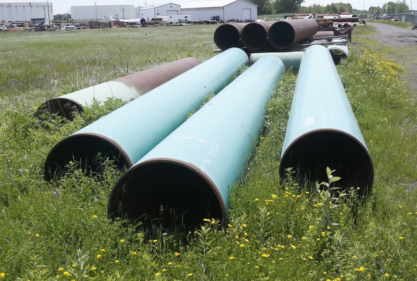 In this 2018 file photo, pipeline used to carry crude oil is shown at the Superior, Wis., terminal of Enbridge Energy.