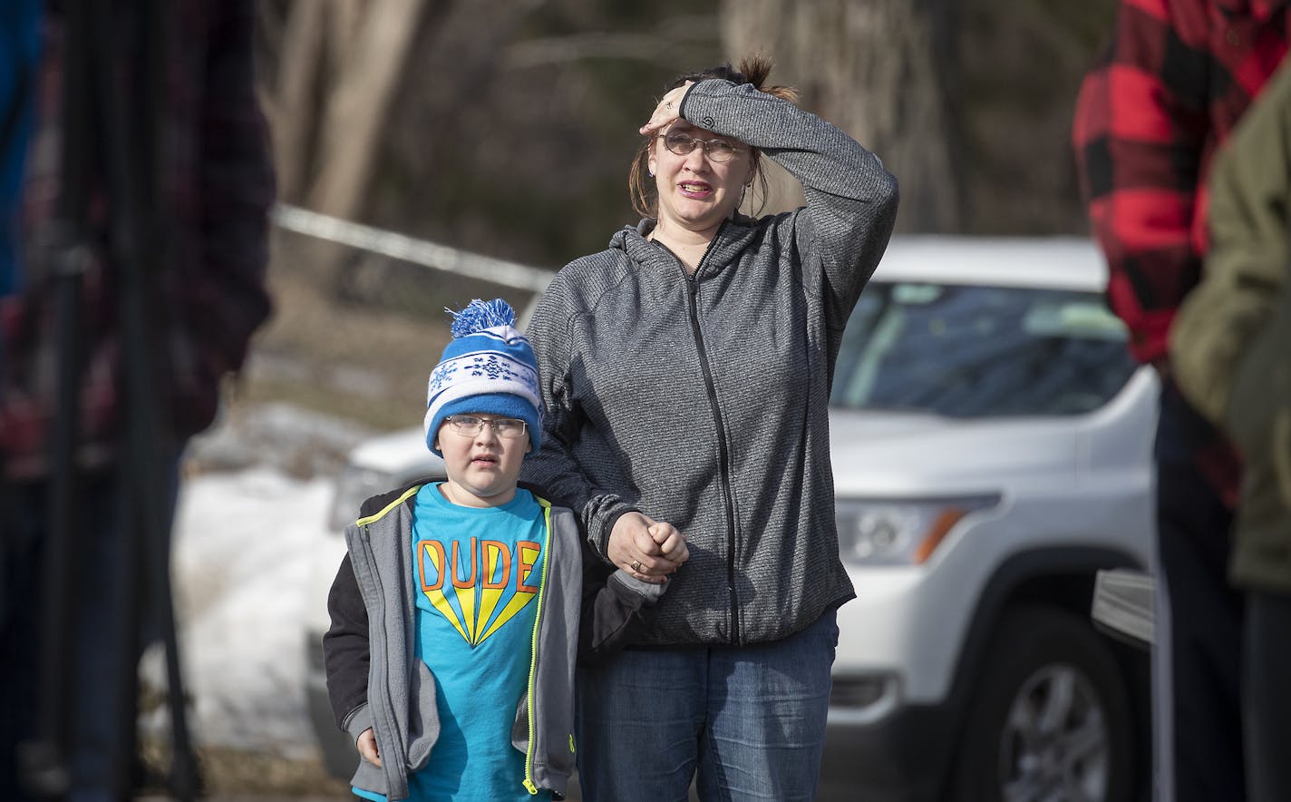 Neighbors gathered and watched as firefighters worked the scene of an early morning fire that claimed the life of one individual, Tuesday, March 26, 2019 in Woodbury, MN. ] ELIZABETH FLORES &#x2022; liz.flores@startribune.com