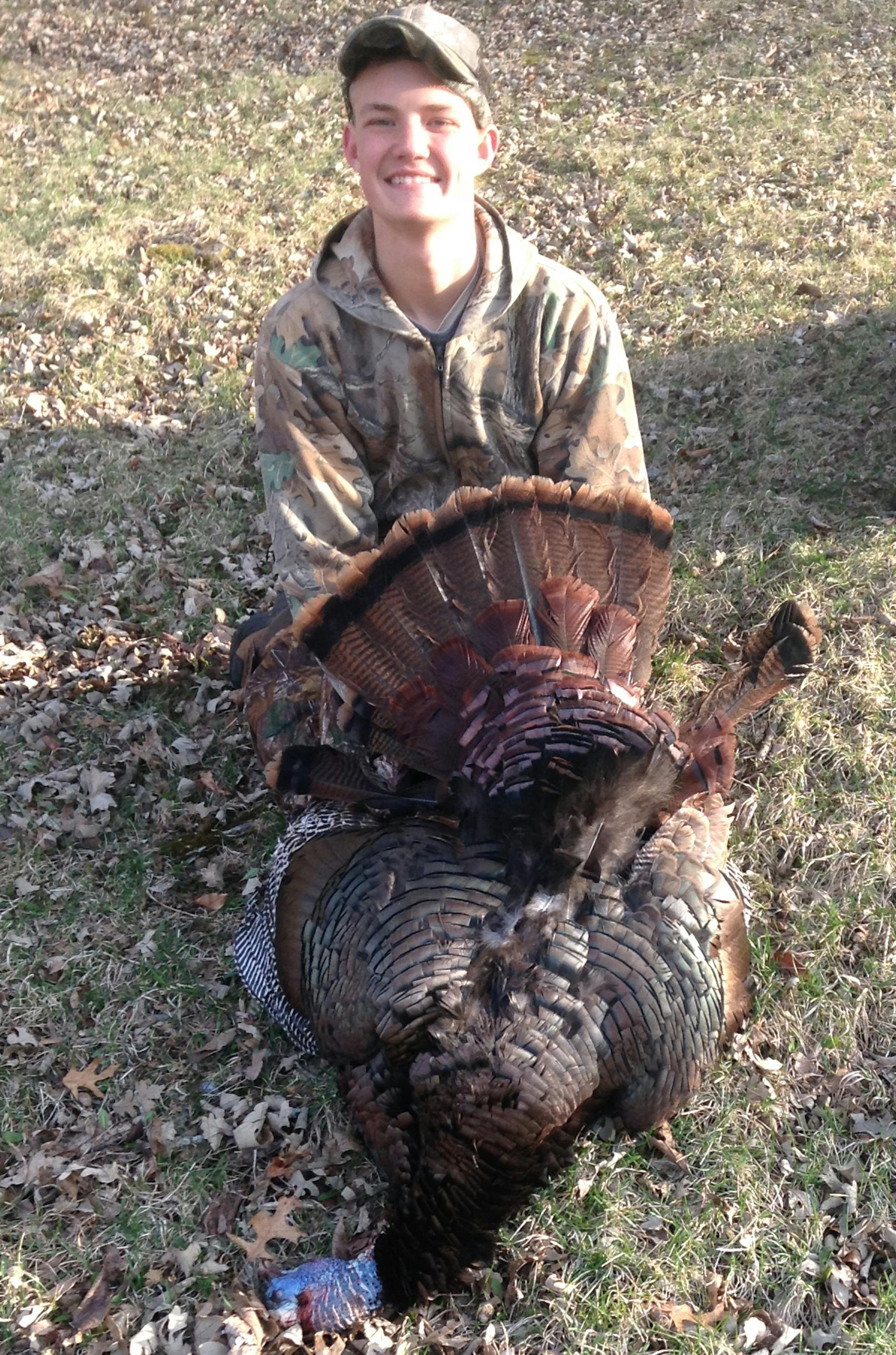 Kelton Vavrosky, 15, of Eagan with his 26-pound gobber. The bird had an 11-inch beard.