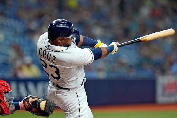 Tampa Bay Rays' Nelson Cruz lines an RBI double off Twins pitcher Randy Dobnak during the third inning
