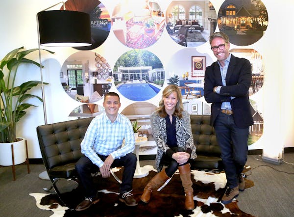 Right to left, Spacecrafting founder Mike McCaw with employees Jenny Terrell and Anthony Dunham at the company&#x2019;s North Loop building in Minneap