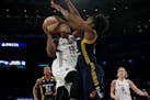 New York Liberty guard Epiphanny Prince (10) goes to the basket against Indiana Fever guard Shenise Johnson during the second half of Game 1 of the WN