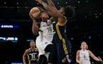 New York Liberty guard Epiphanny Prince (10) goes to the basket against Indiana Fever guard Shenise Johnson during the second half of Game 1 of the WN
